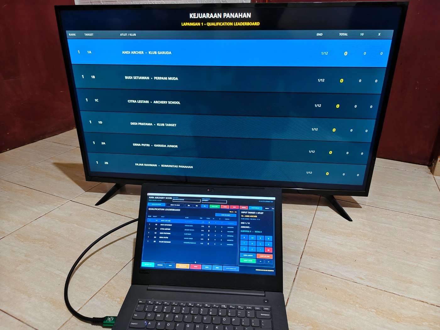 Archery Scoring digunakan operator dengan tampilan TV atau monitor publik