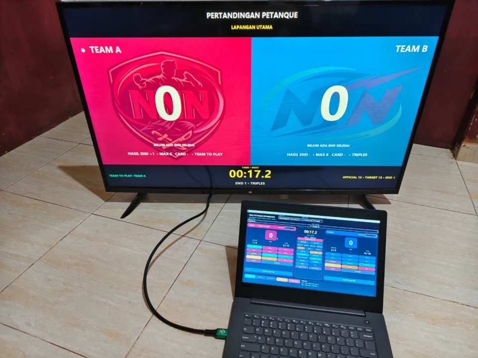 Papan skor Petanque digital digunakan operator dengan End Team To Play timer dan public scoreboard pada TV