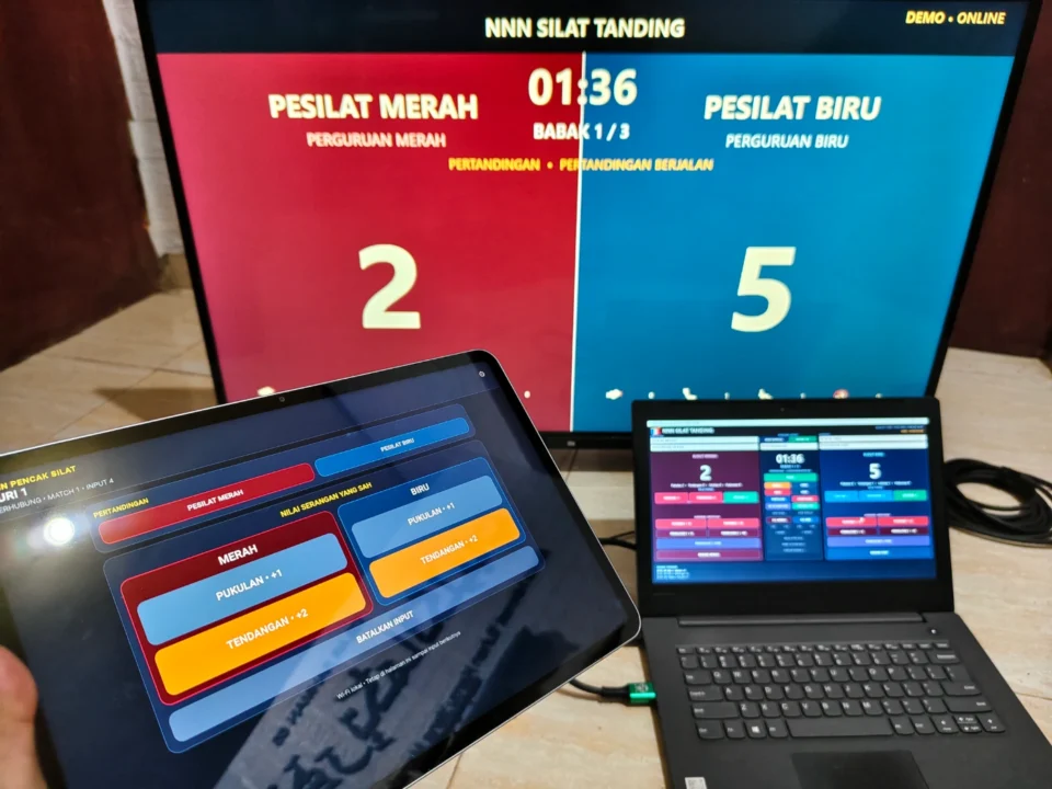 Panel juri Pencak Silat melalui perangkat mobile dengan scoreboard TV