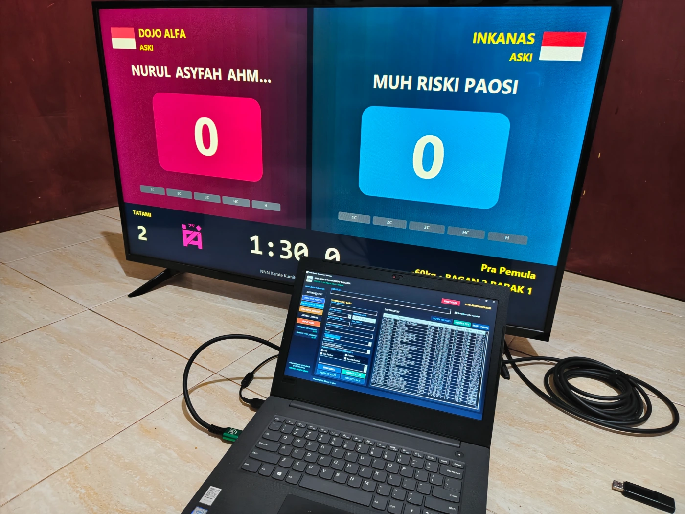 Aplikasi manajemen turnamen Karate pada laptop operator dengan public scoreboard