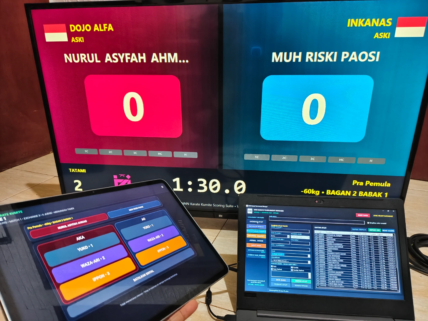 Sistem turnamen Karate Juri WiFi dengan laptop operator tablet juri dan public scoreboard